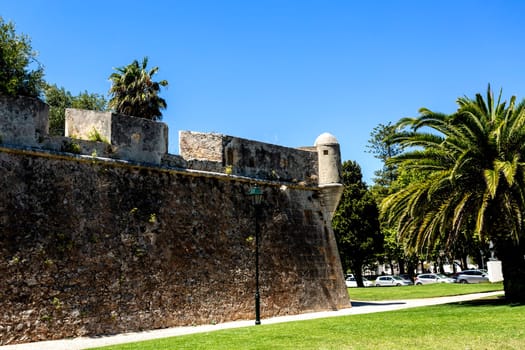 View of rampart wall and watchtower of the 16th century Citadel facing the town of  Cascais, Portugal