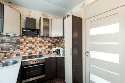 Russia, Moscow- May 20, 2019: interior room apartment. standard repair decoration in hostel. kitchen and dining room