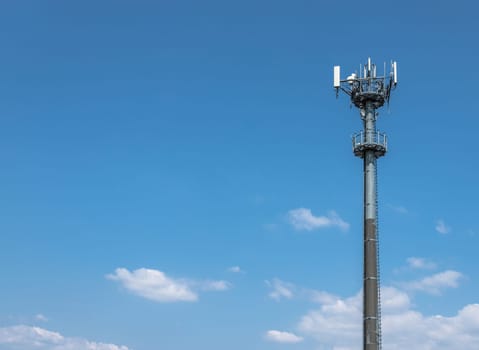 Telecommunication tower on blue sky background