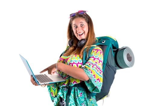 Happy hiker girl with backpack and laptop isolated in white, trekking and travel lifestyle concept