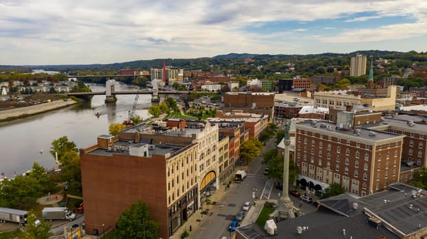 Tugboat and Downtown Troy NY in Rensselaer County along the banks of the Hudson River