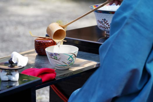Japanese women in kimono prepares the macha green tea ceremony