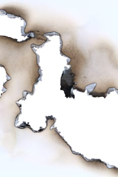 Burnt all through blank sheet of a paper - detail
