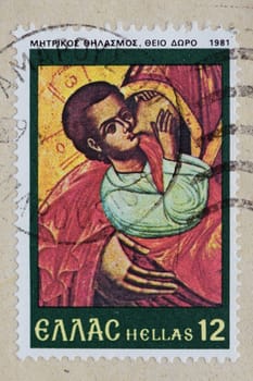 GREECE - CIRCA 1981: Vintage postage stamp with baby jesus breastfeeding detail from byzantine era painting. Printed and postmarked by the Hellenic Post.