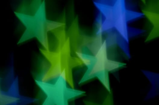 Blue and green stars bokeh abstract motion blur. Colorful background.
