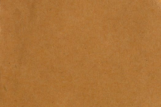 Brown recycled cardboard paper abstract background texture.