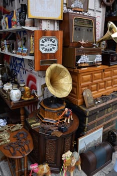 ATHENS, GREECE - APRIL 24, 2015: Vintage objects and furniture for sale at street market antiques shop.