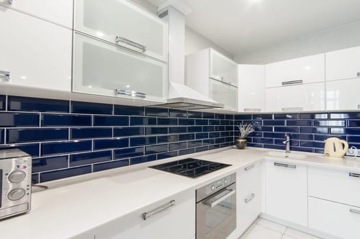 Russia, Moscow- May 21, 2019: interior room apartment. standard repair decoration in hostel. modern kitchen, dining area