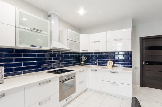 Russia, Moscow- May 21, 2019: interior room apartment. standard repair decoration in hostel. modern kitchen, dining area