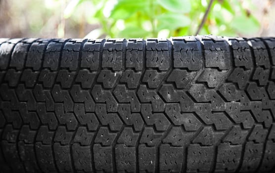 Old car tire closeup. Background texture