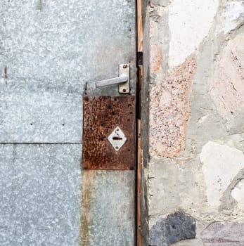 Old iron door with lock. Close up