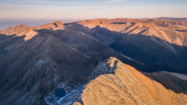 sunset in Caltun lake. Fagaras Mountains, Romania
