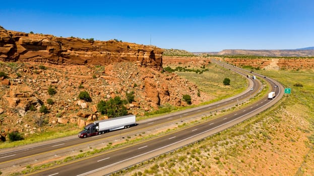 Big Rigs and vacation tavelers drive along the highway in the desert southwest