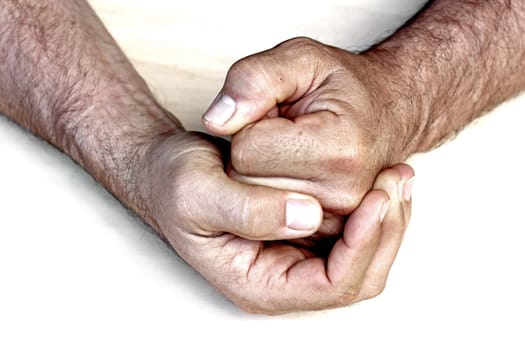 A man clenches his hand to his fist. Rage, anger, violence, aggression