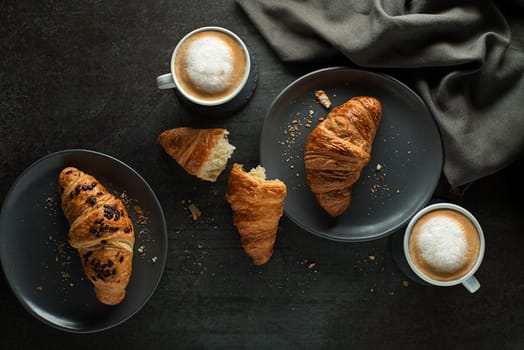 Breakfast served with croissants and coffee. Continental breakfast table