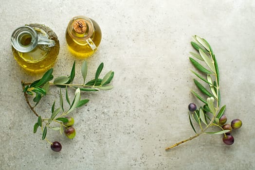 Healthy olive oil bottle with fresh olives ingredients close up. Healthy concept