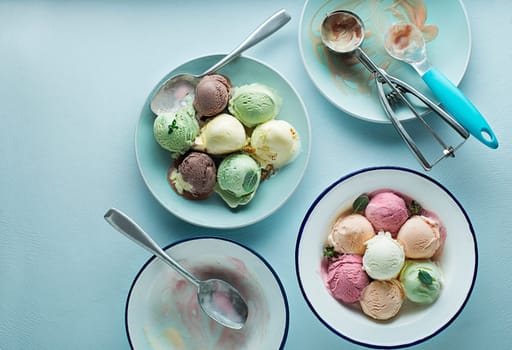 Set of soft ice cream scoops or frozen yogurt of different flavours with berries, nuts and fruits