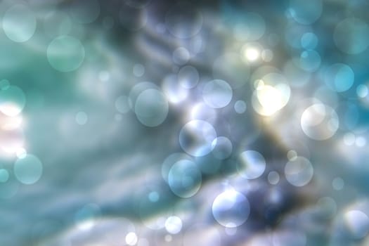 Abstract gradient blue turquoise pink shiny blurred background texture with circular bokeh lights. Beautiful backdrop. Space for design.