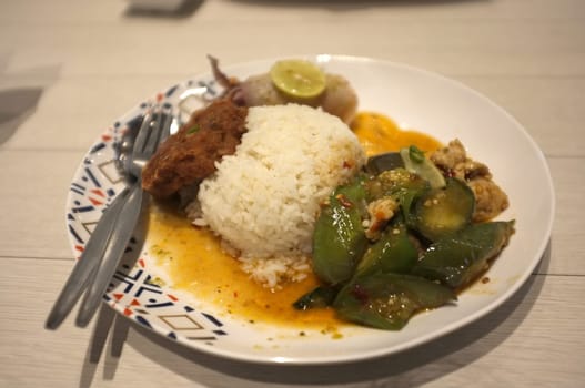 Rice and Spicy stir fry eggplant and minced pork in Rice and Curry Shop at Central Village outlet near Suvarnabhumi , Thailand
