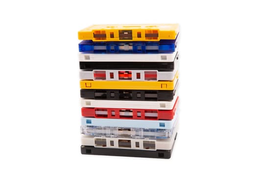 Colorful stacked Music Tapes from the 80s on bright Background