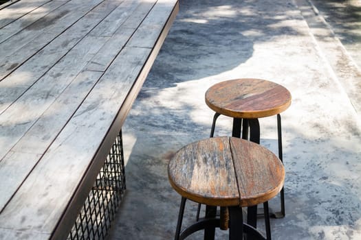 Wooden outdoors seats in summer garden, stock photo