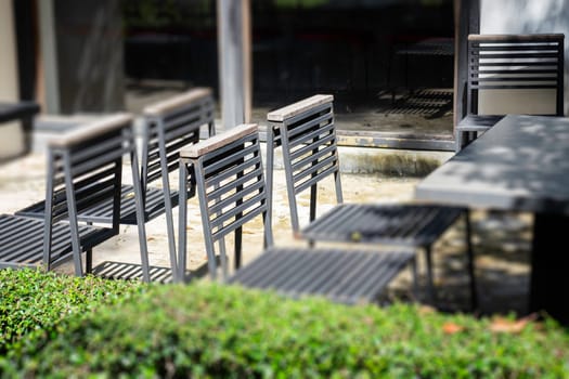 Wooden outdoors seats in summer garden, stock photo