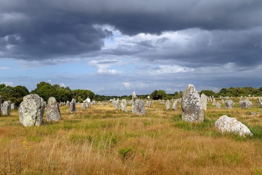 Alignements du Menec - rows of Menhirs - standing stones - the largest megalithic site in the world, Carnac, Brittany, France.