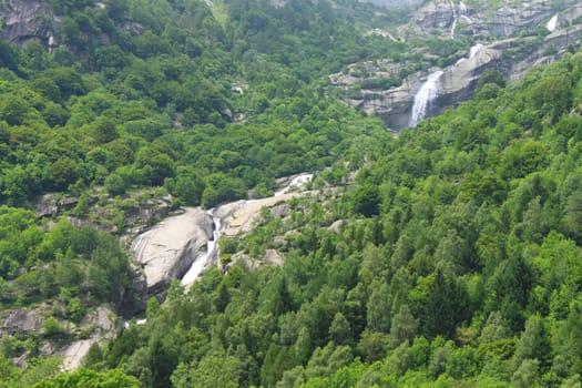 The double waterfall in the middle of the trees in Italy