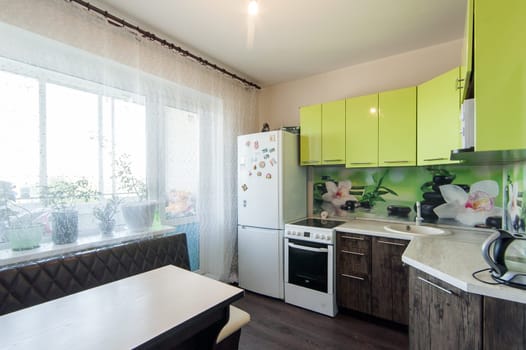 Russia, Moscow- May 29, 2019: interior room apartment. standard repair decoration in hostel. kitchen and dining room