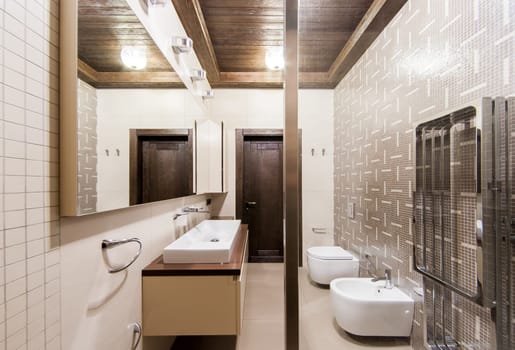 Russia, Moscow- May 29, 2019: interior room apartment. standard repair decoration in hostel. modern bathroom, sink, decoration elements, toilet