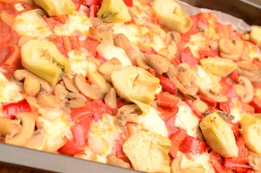 Vegetarian pizza on a wooden table