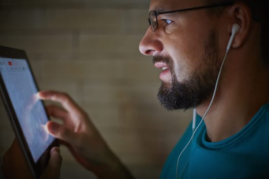 Modern man with touchpad networking in the dark
