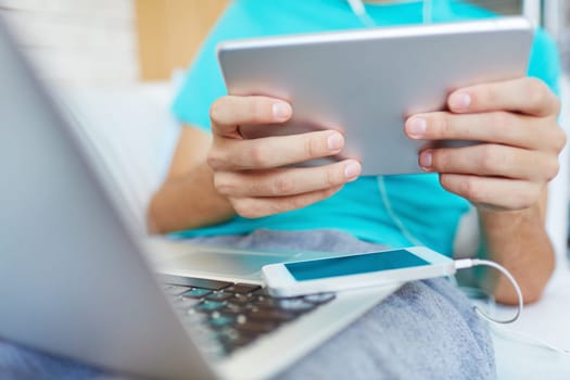 Male hands holding digital tablet