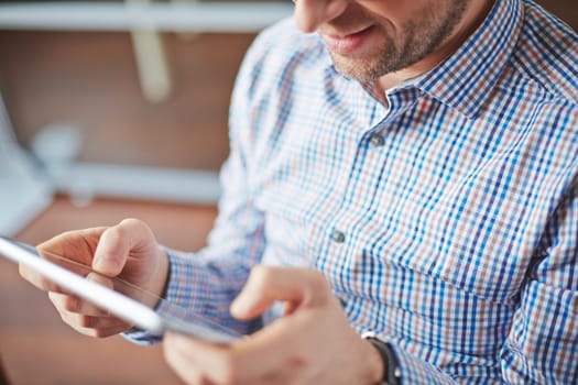 Modern man holding touchpad