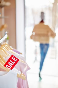 Elegant clothes on hangers with special prices