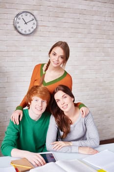 Group of students sitting in library after classes