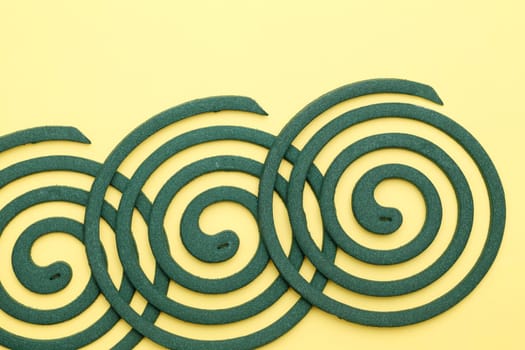 mosquito spiral on yellow background