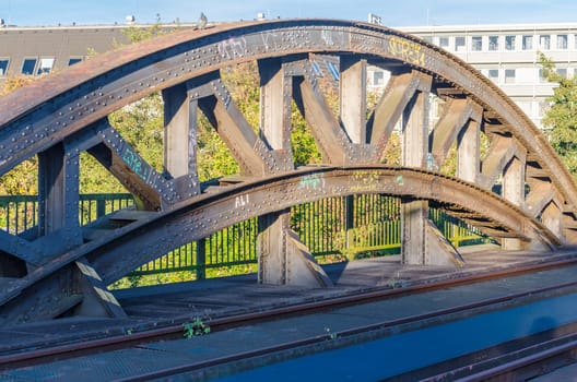 Riveted old bridge arch of an old railway bridge.