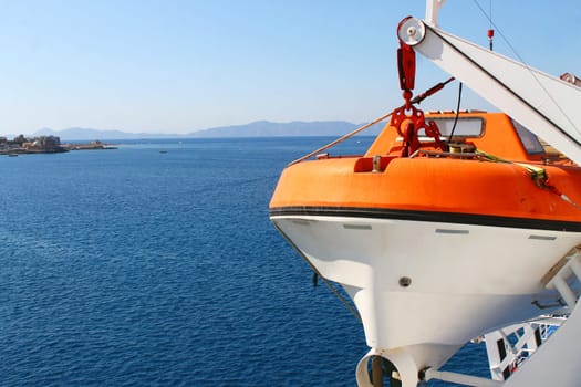 White and orange lifeboat in the aegean sea