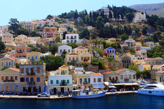 Historic Simi island houses and boats in Grece