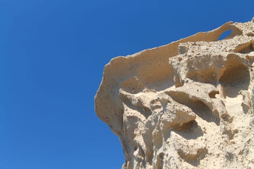 The sand rock and the blue sky in Santorini
