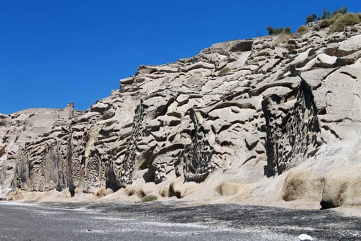 Layered brown cliff and rocks in Greece