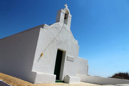 The white Greek church and the blue sky in Folegandros