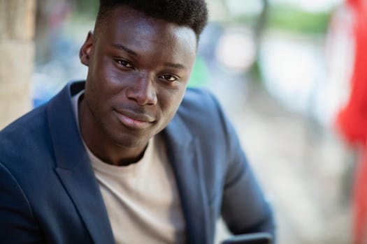 Businessman looking at the camera and smiling.