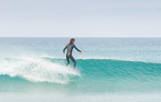 PENICHE, PORTUGAL - DECEMBER 02, 2016: Surfer riding a wave on surfboard. Peniche is a famous surfing destination in Portugal
