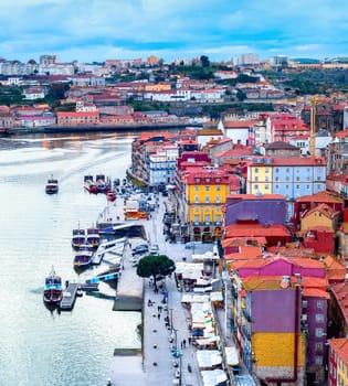 Porto aerial cityscape, old town embankment by Douro river with tourist boats . Portugal