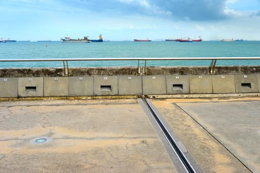 Singapore harbor. Industrial cargo ships in the background