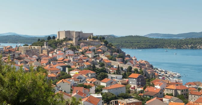 Historic city centre of Sibenik, Croatia with St. Michael's Fortress. Adriatic Sea in the background.
