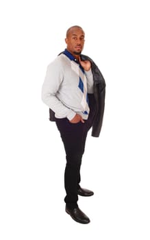 A handsome young African American man standing in jeans and a.sweater in profile, isolated for white background.