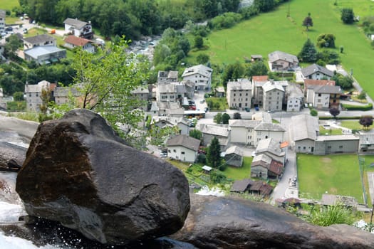The historic houses from the rock in the balance in the Alps